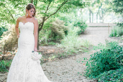 Bride posing in garden